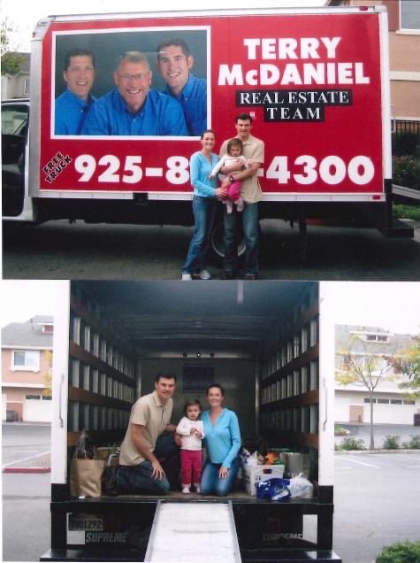 Clients loading the Terry McDaniel Real Estate Team moving truck